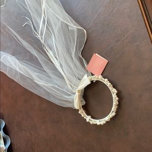 Child’s headband with white lace veil